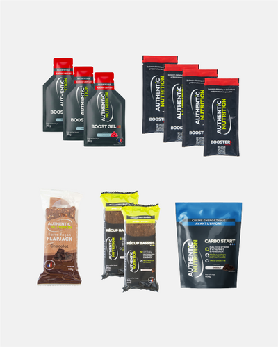 Assortiment de nutrition sportive Authentic Nutrition avec gels, sachets de boisson, barres énergétiques et crème Carbo Start.